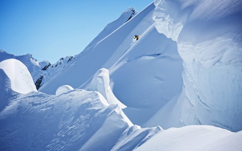 A skier riding big-mountain terrain in the Chugach Range, Valdez, Alaska