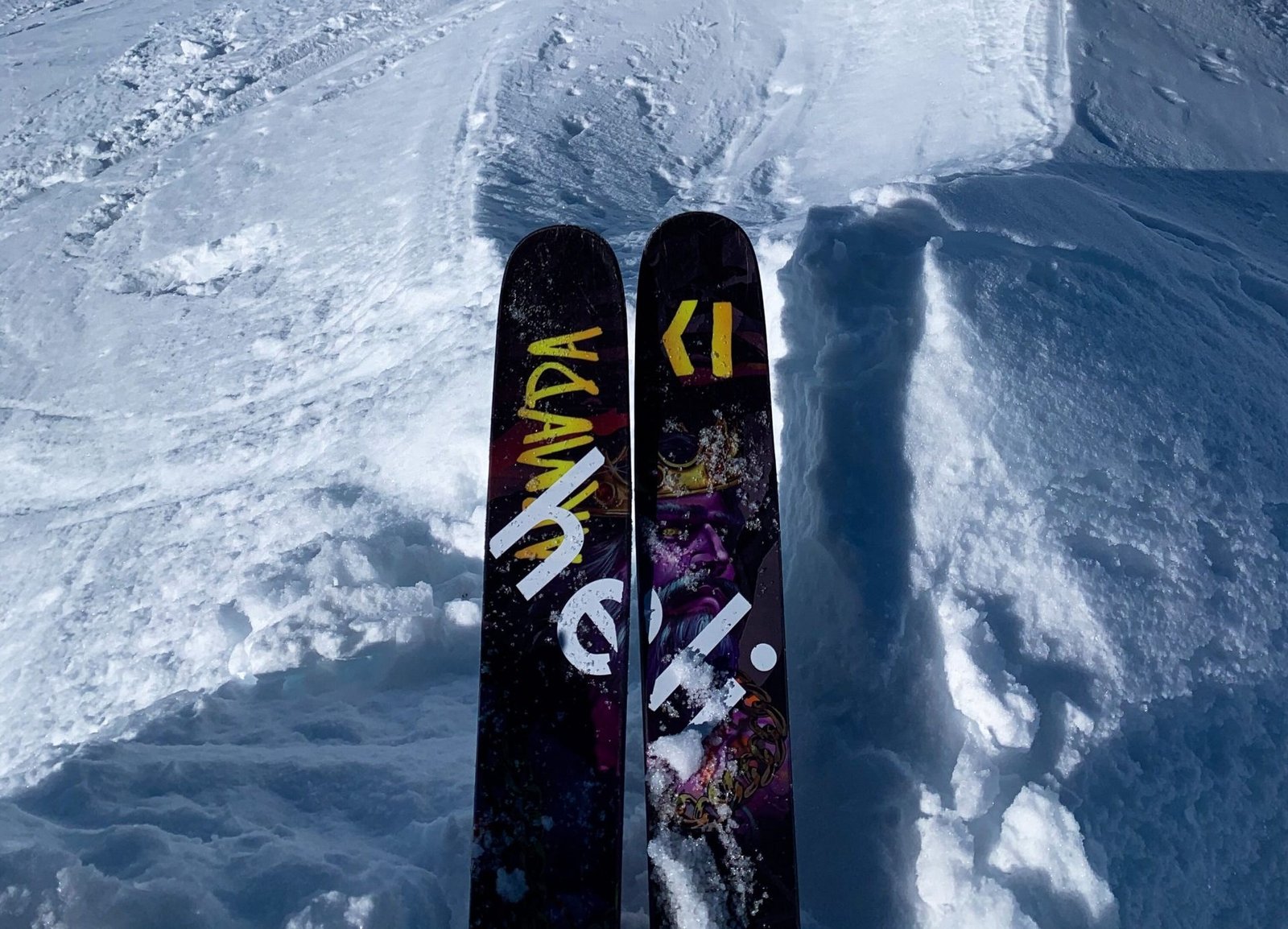 A helicopter and skiers in the Chugach Mountains, Valdez, Alaska