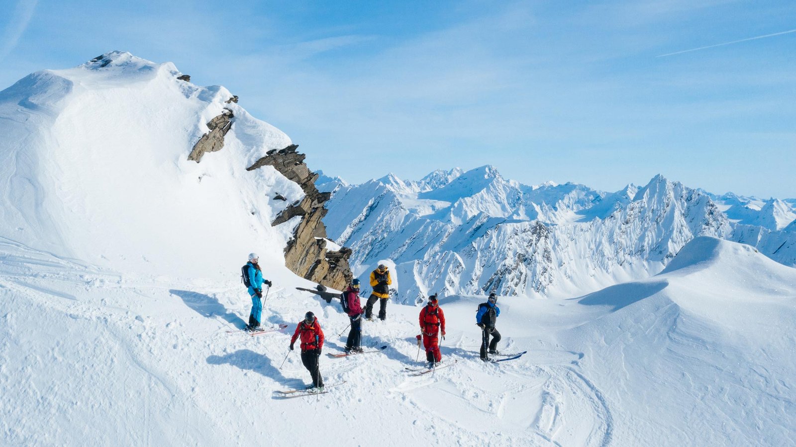 A skier dropping into a steep spine in the Chugach Mountains, Valdez, Alaska