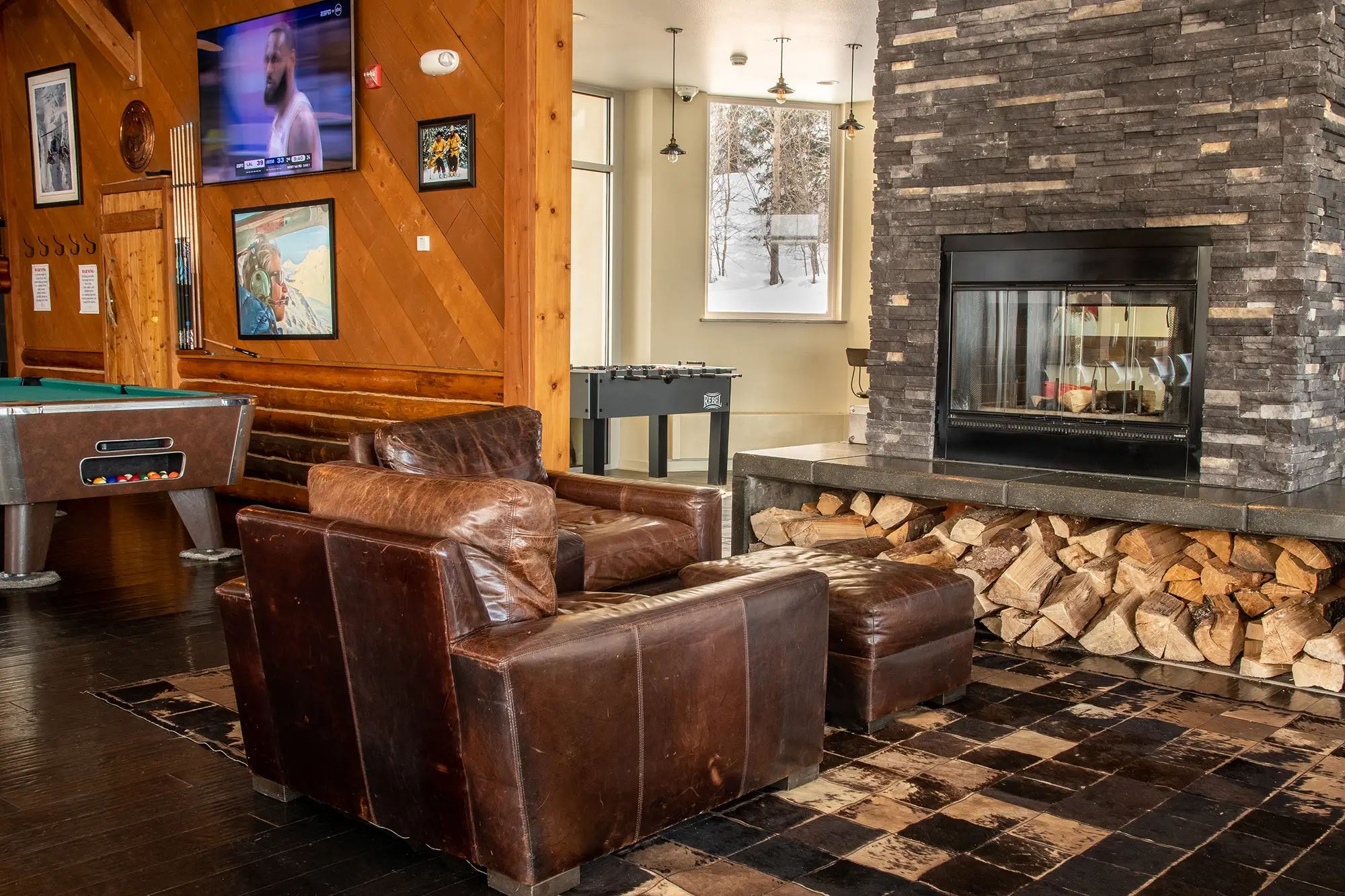 A cozy fireplace inside the Tsaina Lodge