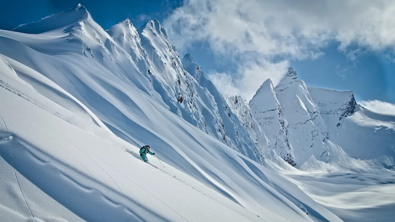 A skier descending a steep Chugach face near Valdez, Alaska - featured by CNN Travel