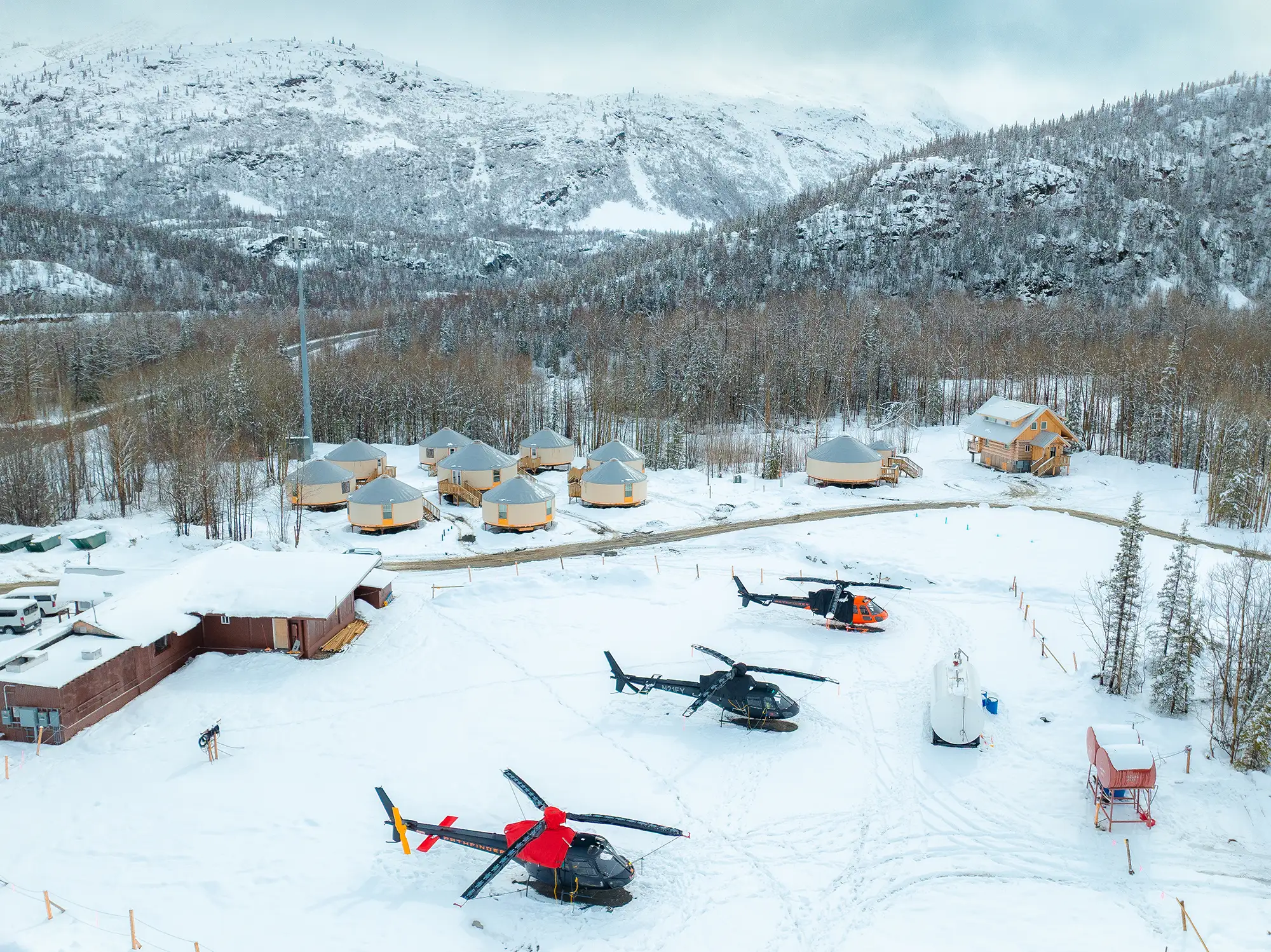 The Alaska Rendezvous Lodge heli-pad, luxury yurts and The Crow bar beneath the Chugach Mountains, Thompson Pass, Alaska