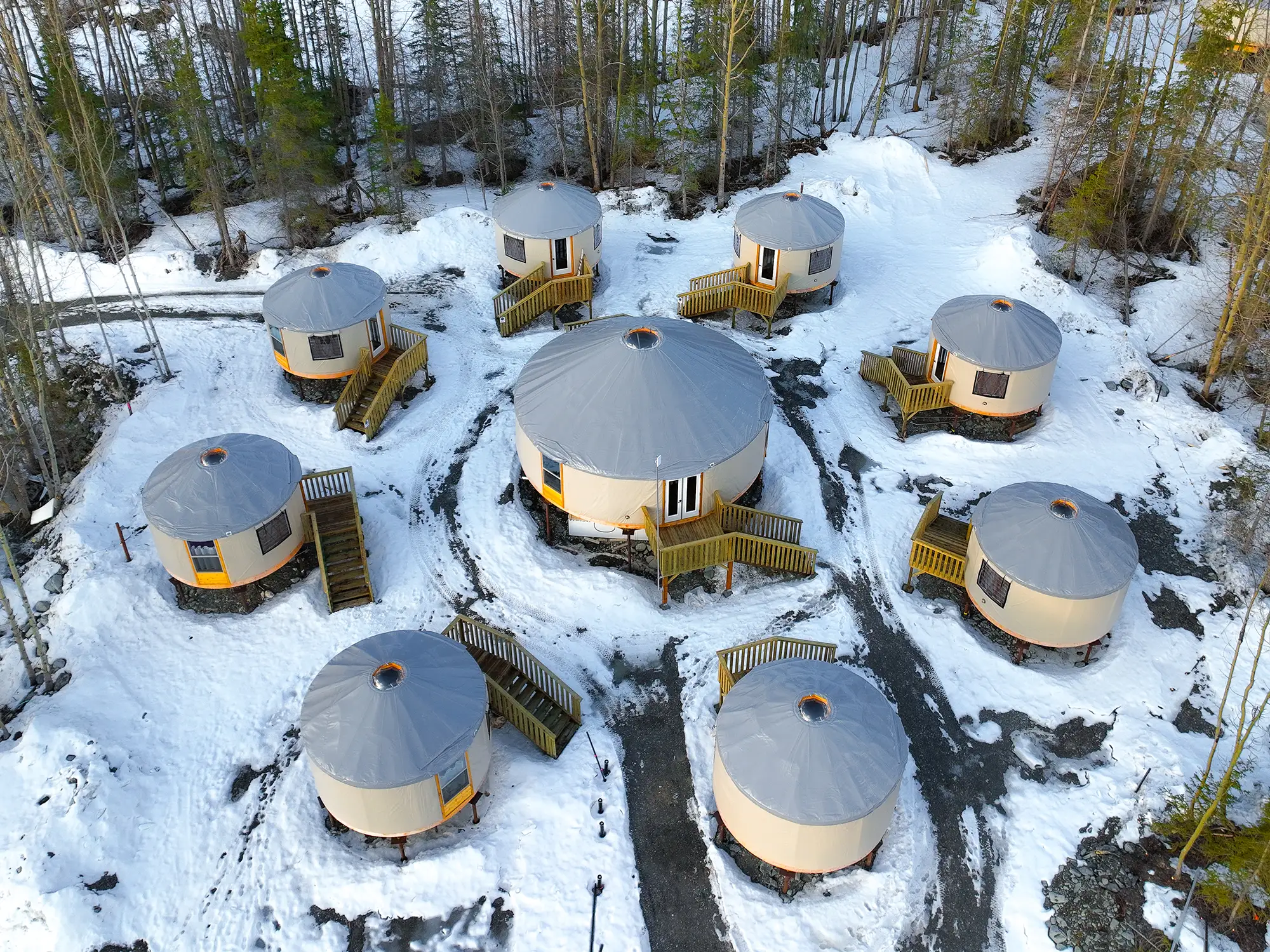 The private yurt island at the Alaska Rendezvous Lodge - single-bedroom yurts around a private lounge