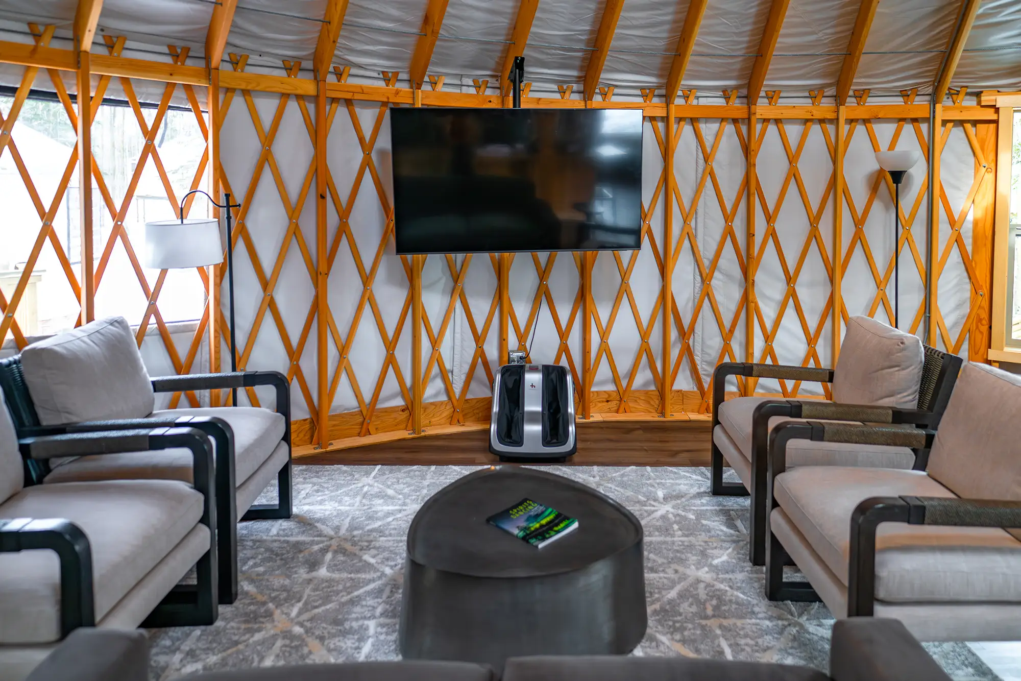 The private TV lounge yurt with couches at the Alaska Rendezvous Lodge