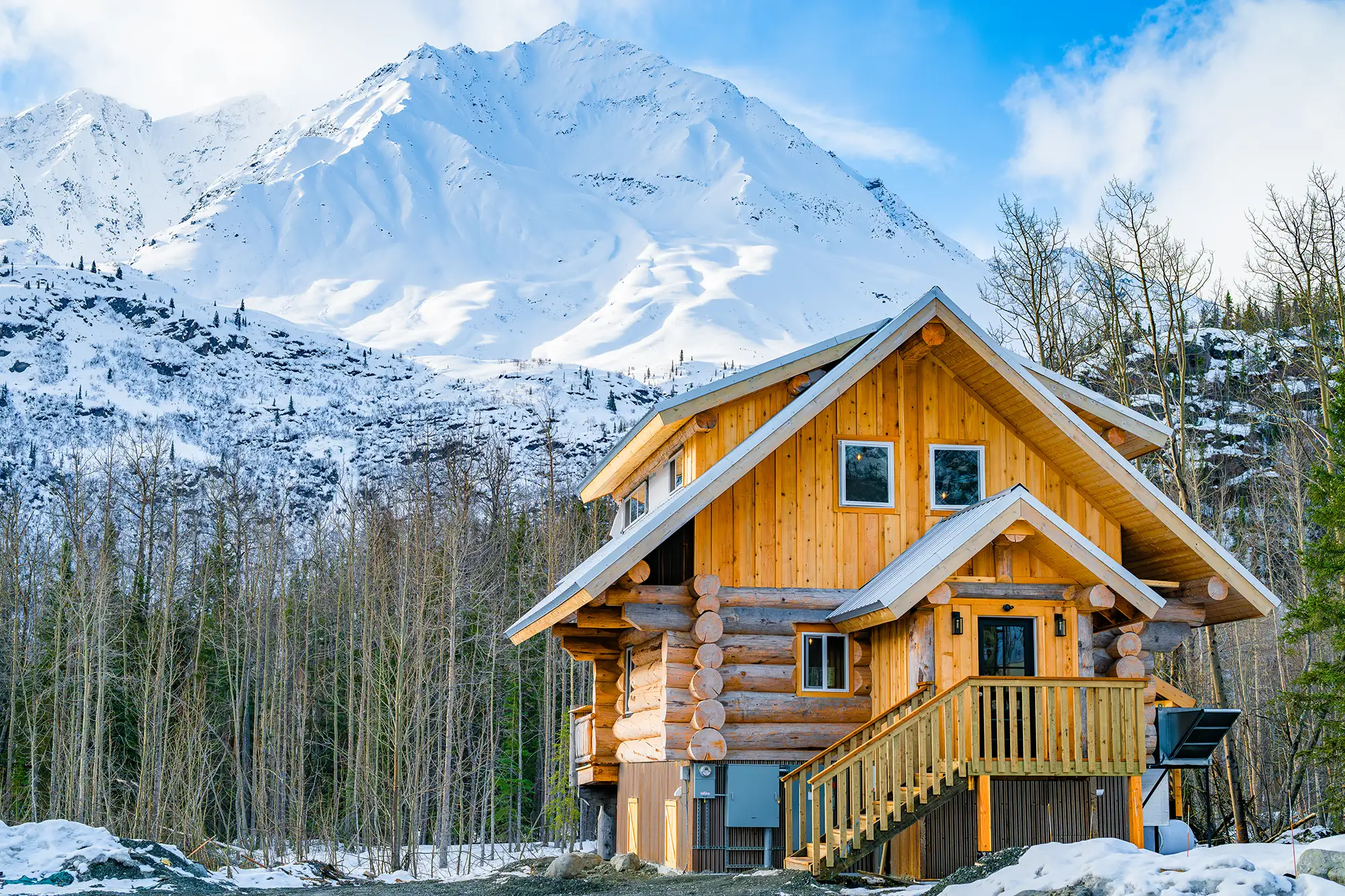 The Crow bar with the Chugach Mountains rising behind it at the Alaska Rendezvous Lodge