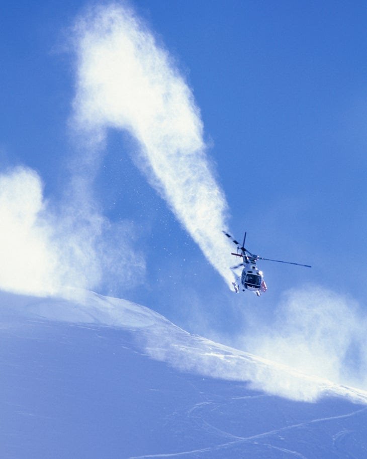 A helicopter dropping athletes on an unnamed peak above Thompson Pass, Alaska