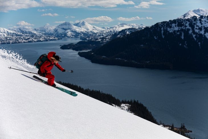 Lynsey Dyer skiing corn snow above the ocean in Prince William Sound, Alaska